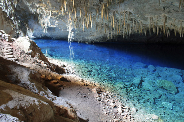 The iridescent blue of the waters inside the Gruta do Lago Azul