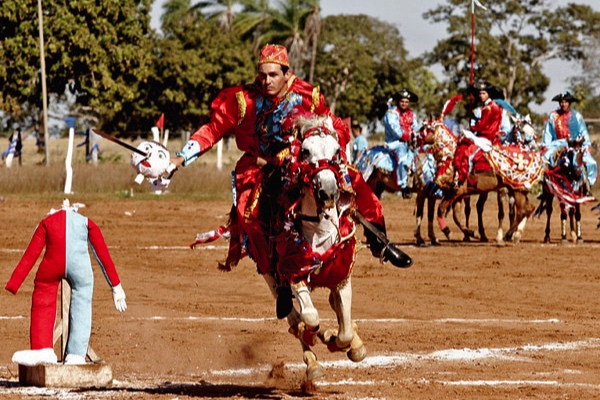 Cavalhada participants ride on horseback, competing in a range of events.